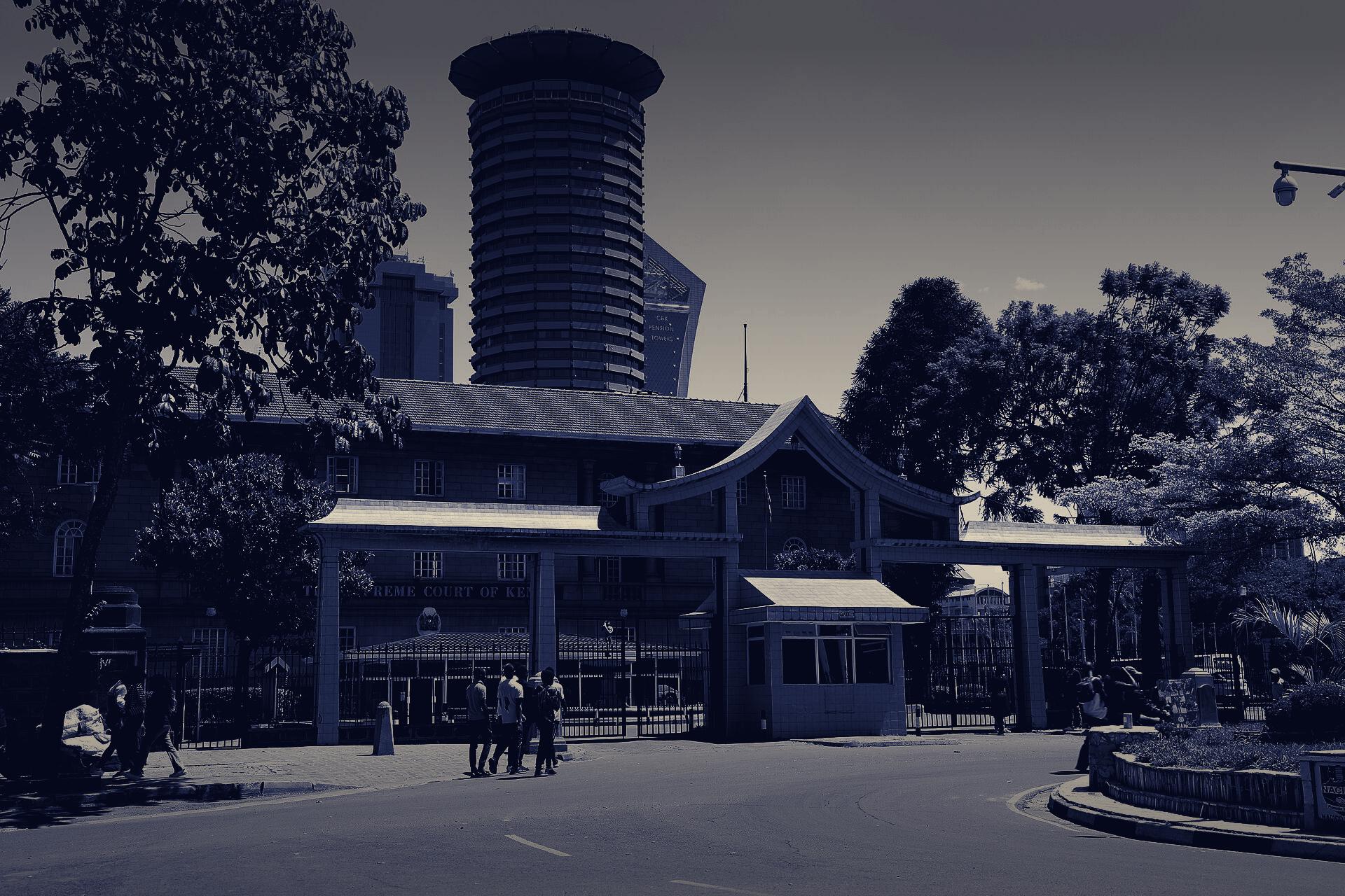The Supreme Court of Kenya in Nairobi, with the Kenyatta International Conference Centre tower behind it, at dusk